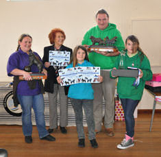 The Johnson family receiving the trophies for Top Working Dog